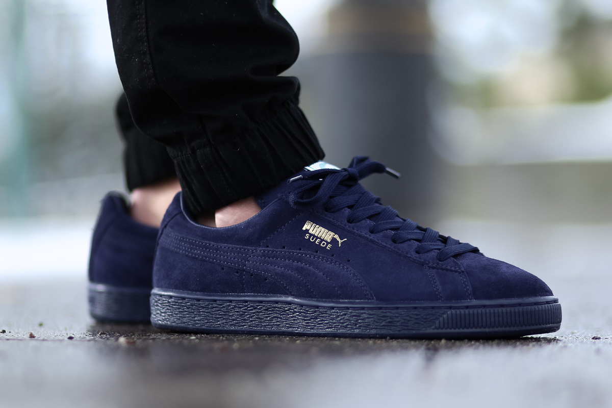 navy blue and gold pumas