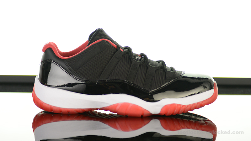 black and red jordan 11 low