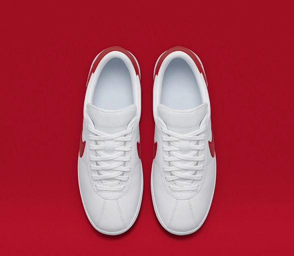 white nike bruin shoes with red swoosh