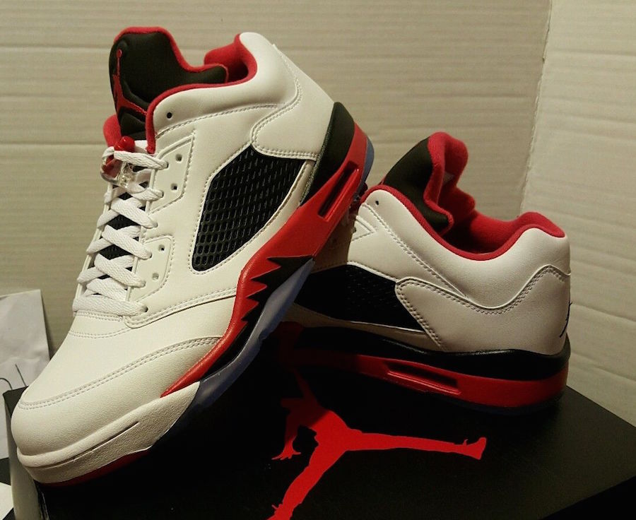 red black and white low top jordans