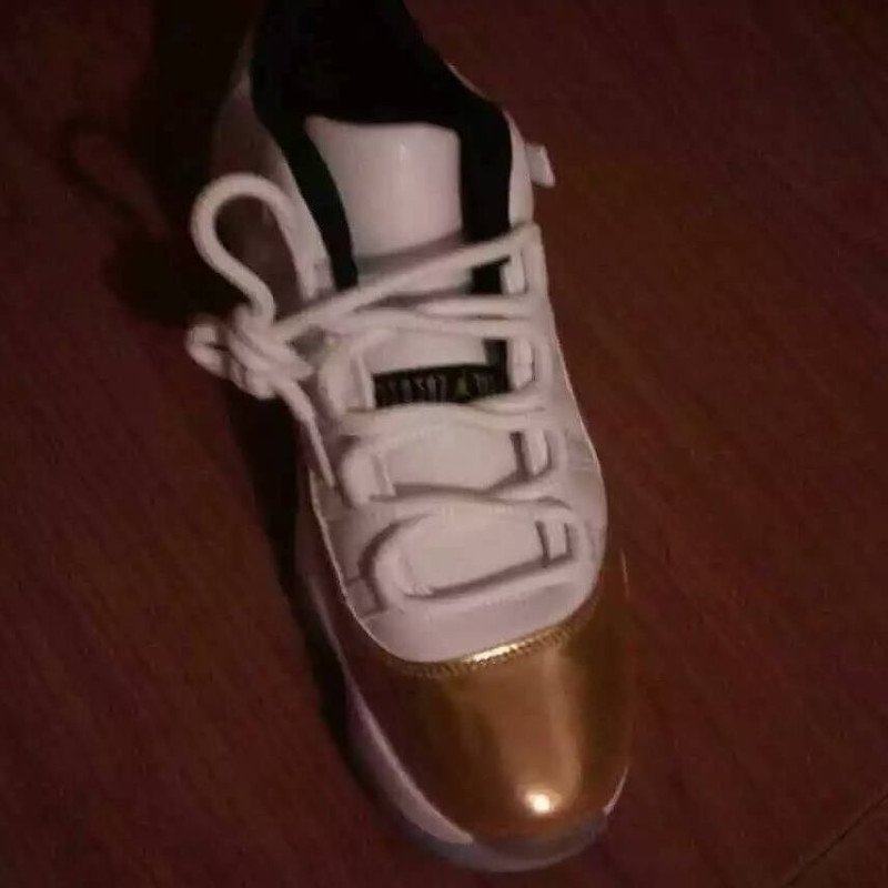 white and gold low top 11s