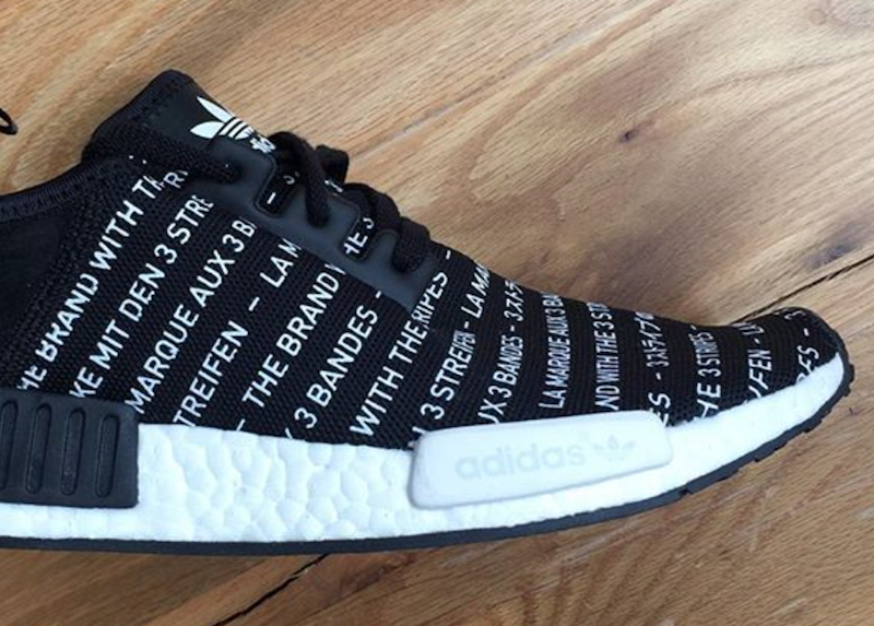 black nmd with white writing