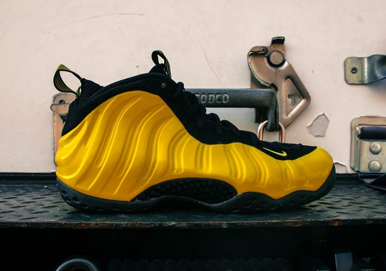 yellow and black nike foams
