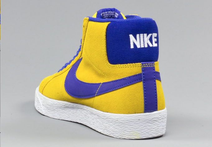 white and yellow nike blazers