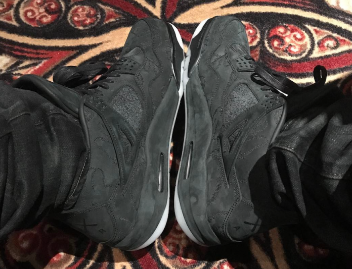 drake- kaws-x-air-jordan-4-black-1 Drake Wears KAWS x Air Jordan 4 Black