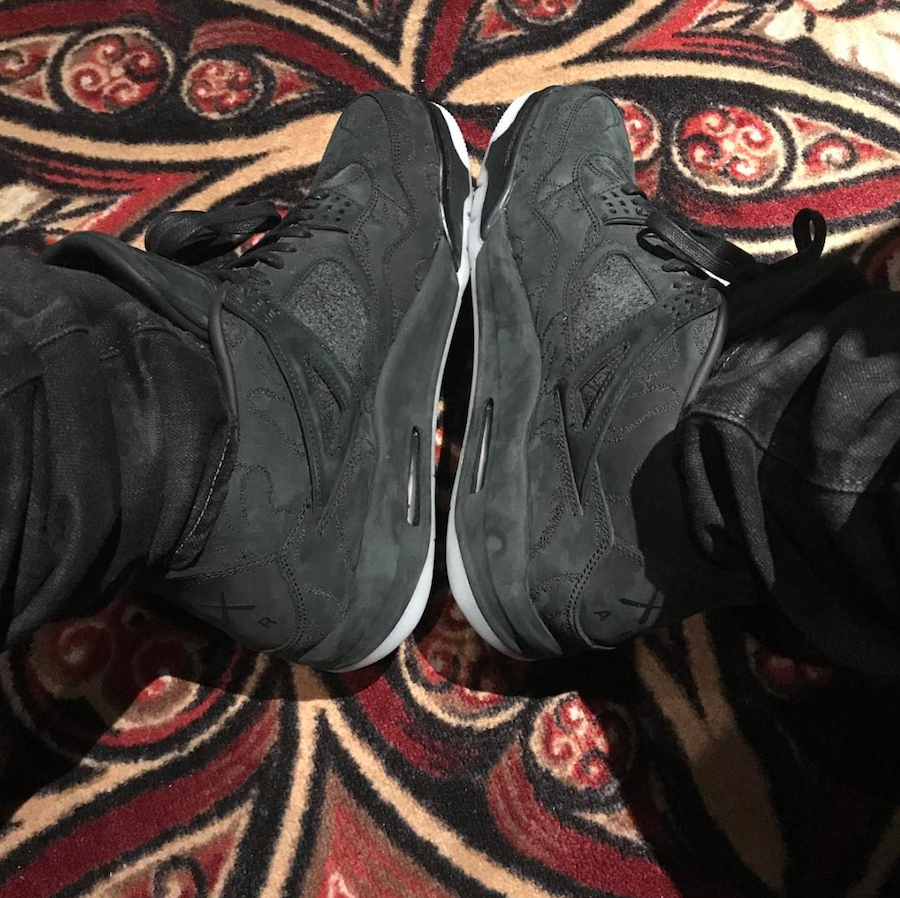 Drake Wears KAWS x Air Jordan 4 Black