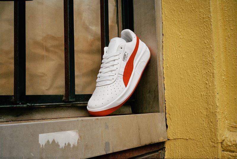 puma white and red sneakers