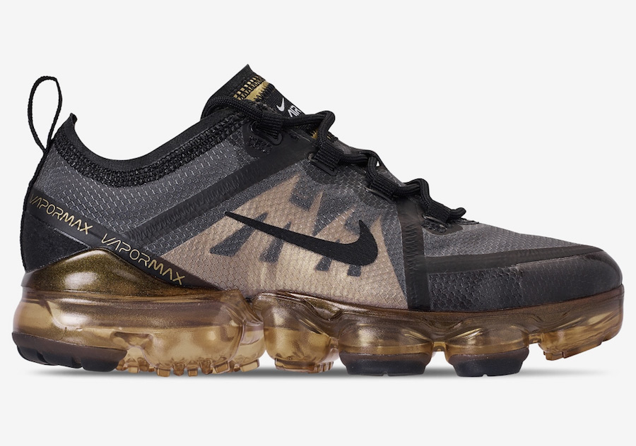 all black vapormax with gold check