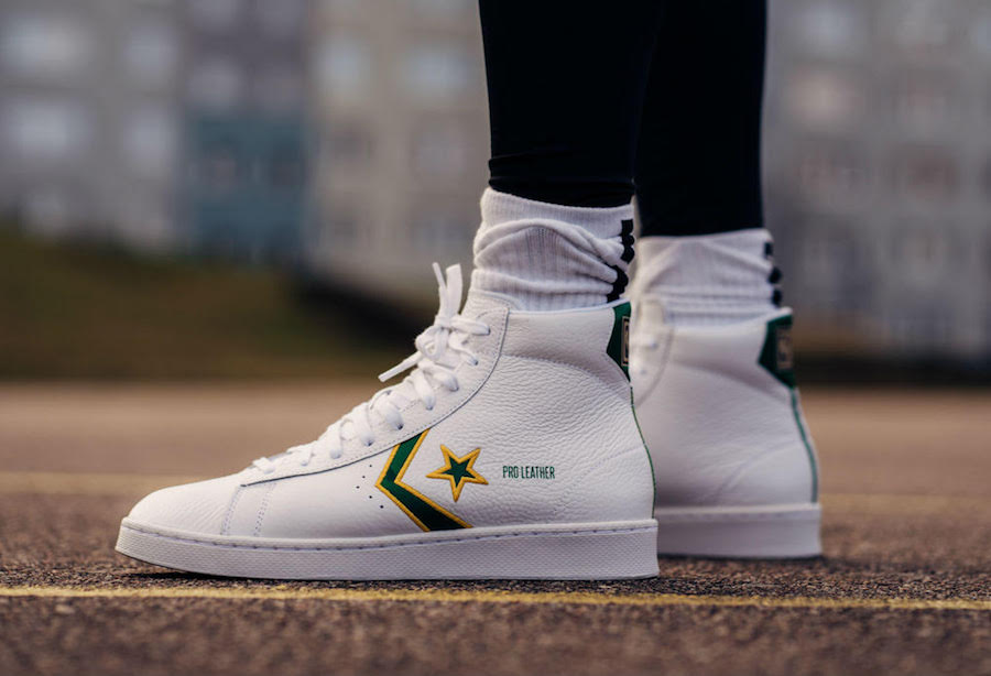 white leather mid top converse