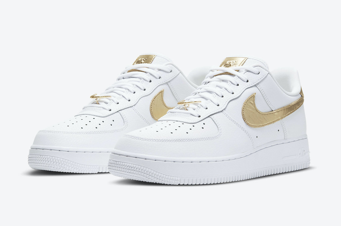gold and white nike air force 1