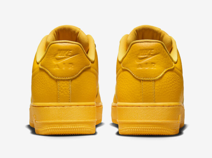 university gold nike air force 1