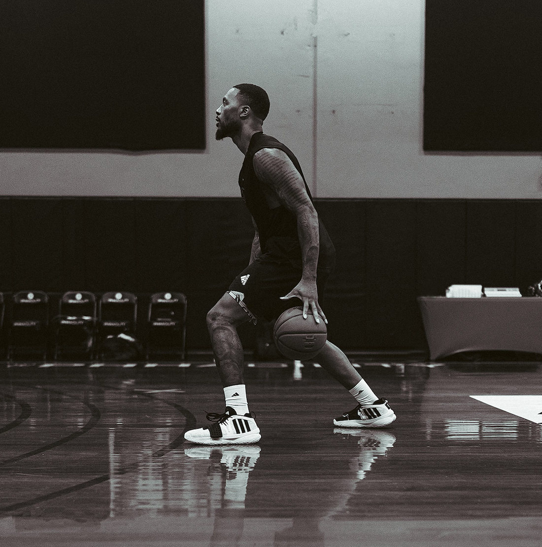Damian Lillard playing basketball in the adidas DAME 8 EXTPLY