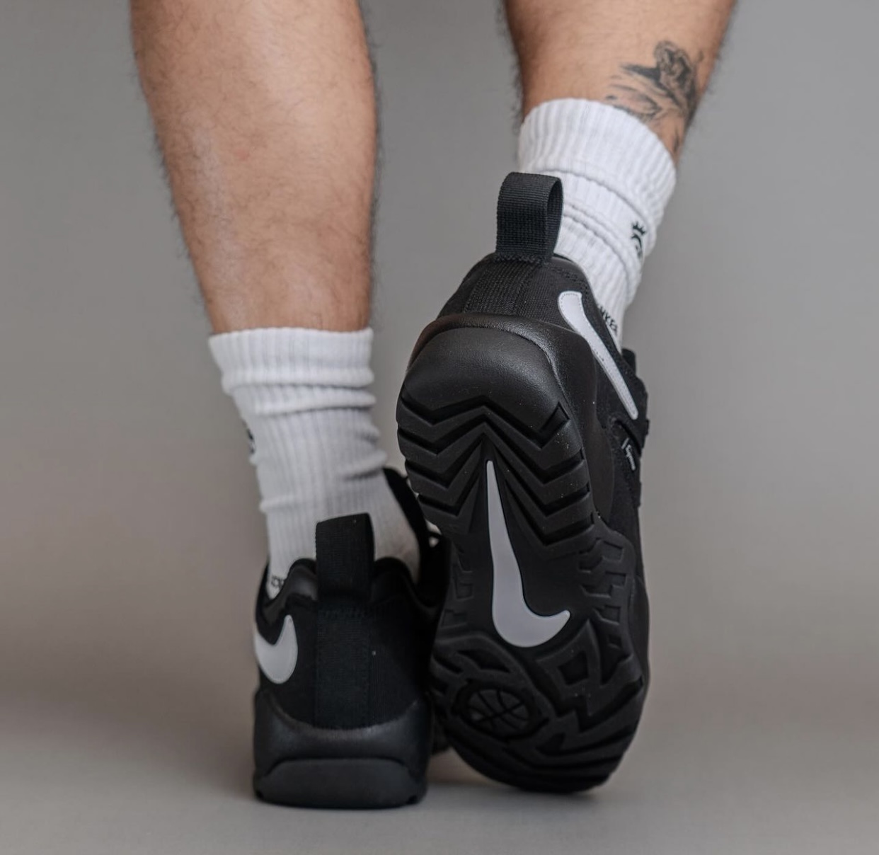 Supreme Nike SB Darwin Low Black FQ3000 001 On Feet 8