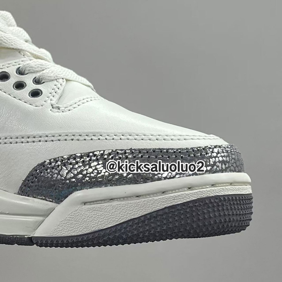 Close-up of the Air Jordan 3 Sail Metallic Silver toe box highlighting reflective detailing and premium leather.