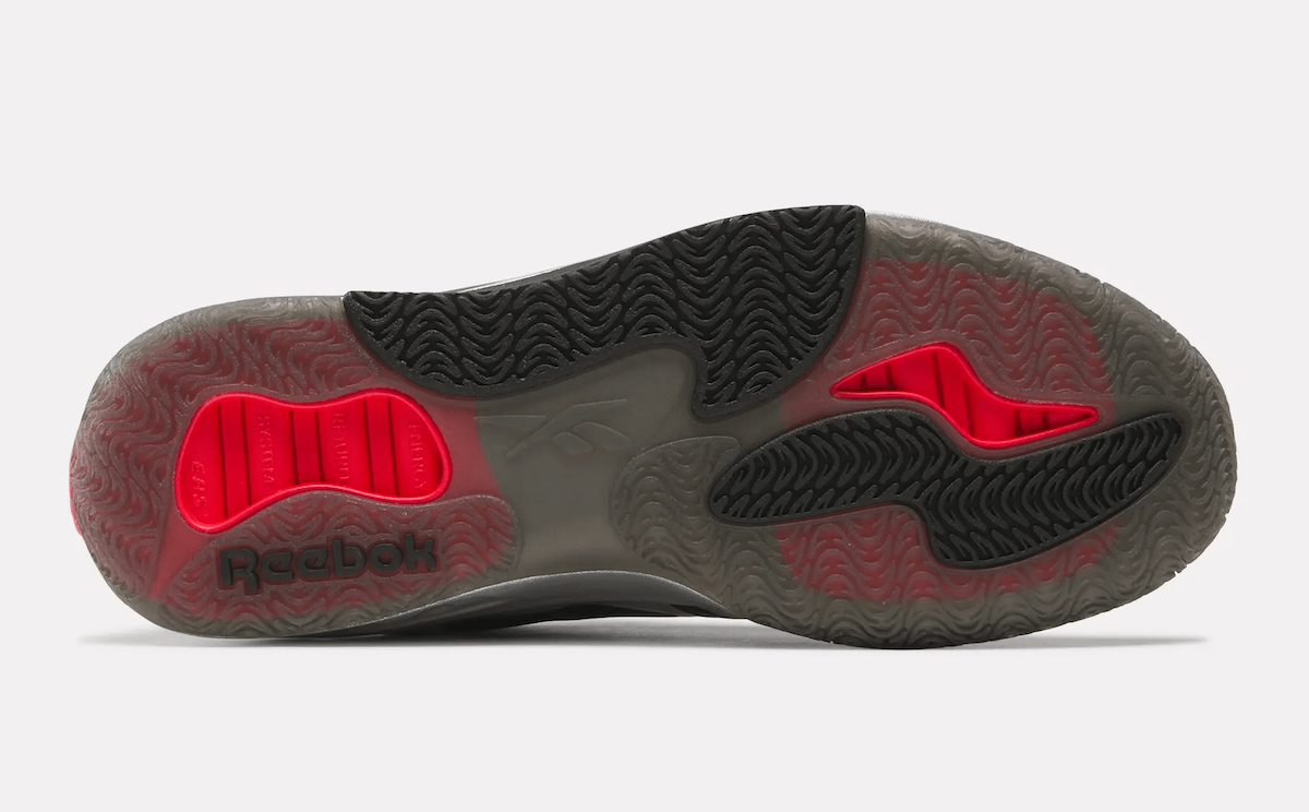 Reebok Engine A Black Silver outsole displaying the semi-translucent rubber traction pattern with red energy return pods for enhanced stability