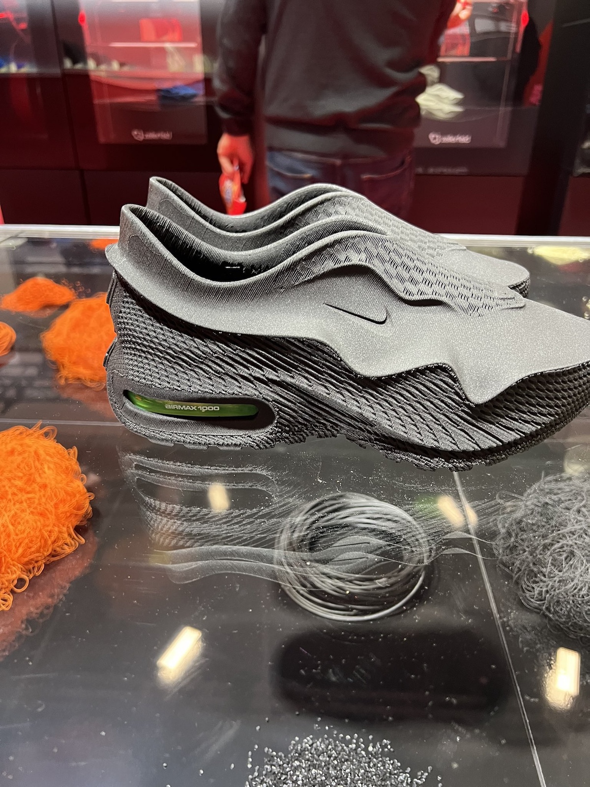 A first look at the Nike Air Max 1000 in sleek black, designed with a 3D-printed upper and green-tinted Air unit for a modern, high-tech appeal.