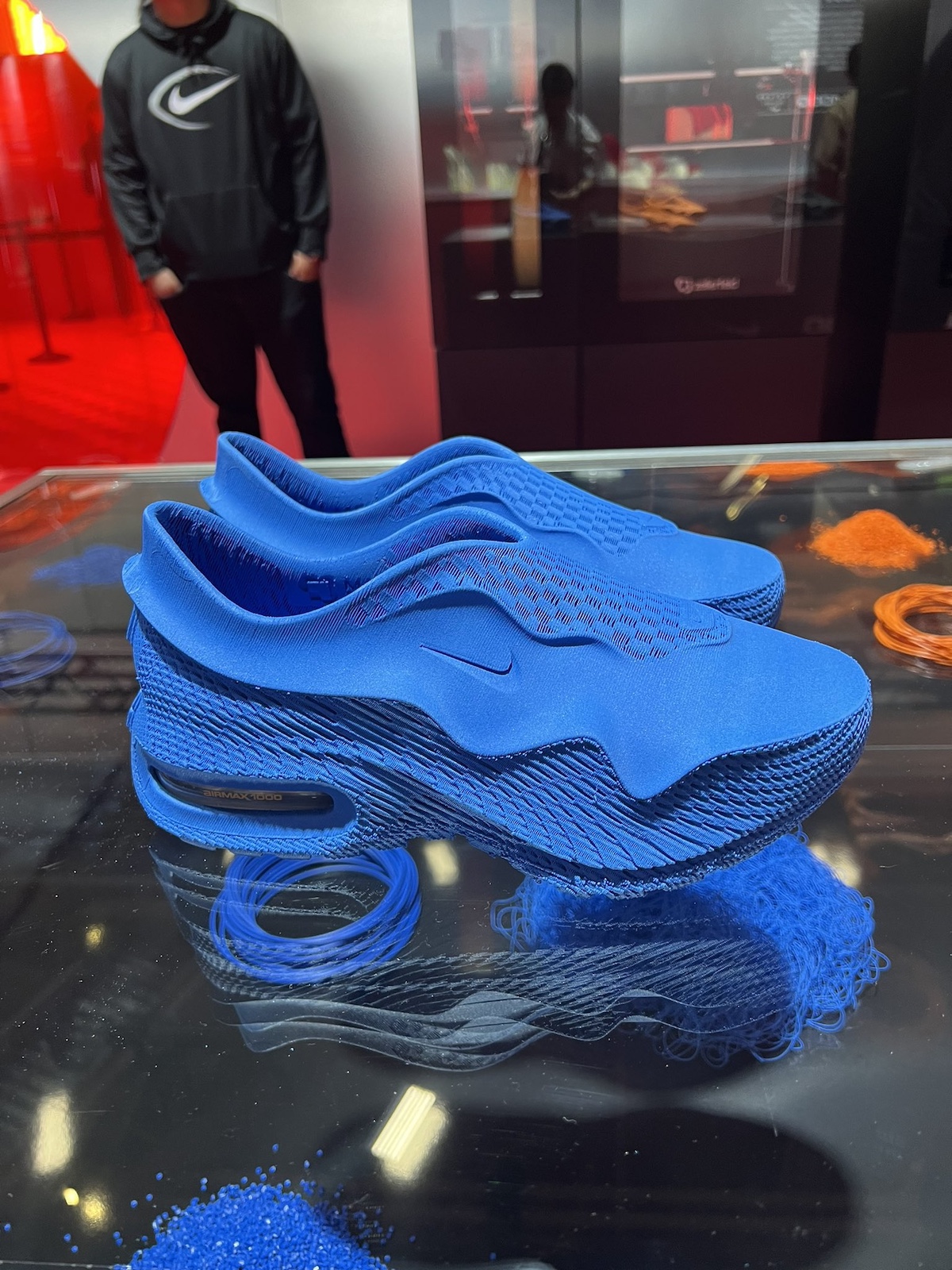 The Nike Air Max 1000 in a bold blue colorway, featuring a seamless 3D-printed structure with an Air cushioning unit for performance and style.