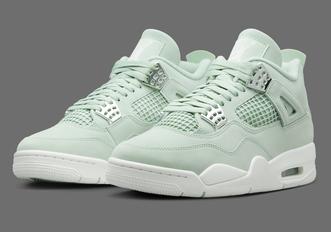 A pair of Air Jordan 4 'Seafoam' sneakers in a soft pastel green colorway, featuring a suede upper, signature mesh netting on the sides and tongue, metallic lace eyelets, and a white midsole with visible Air cushioning.