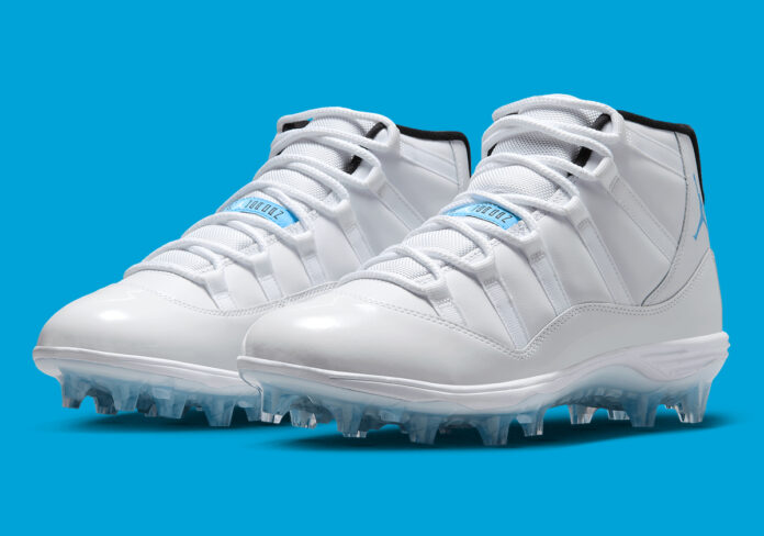 Main Angle of Air Jordan 11 Legend Blue TD Cleats: A side-front view showcasing the classic white upper and light blue accents.
