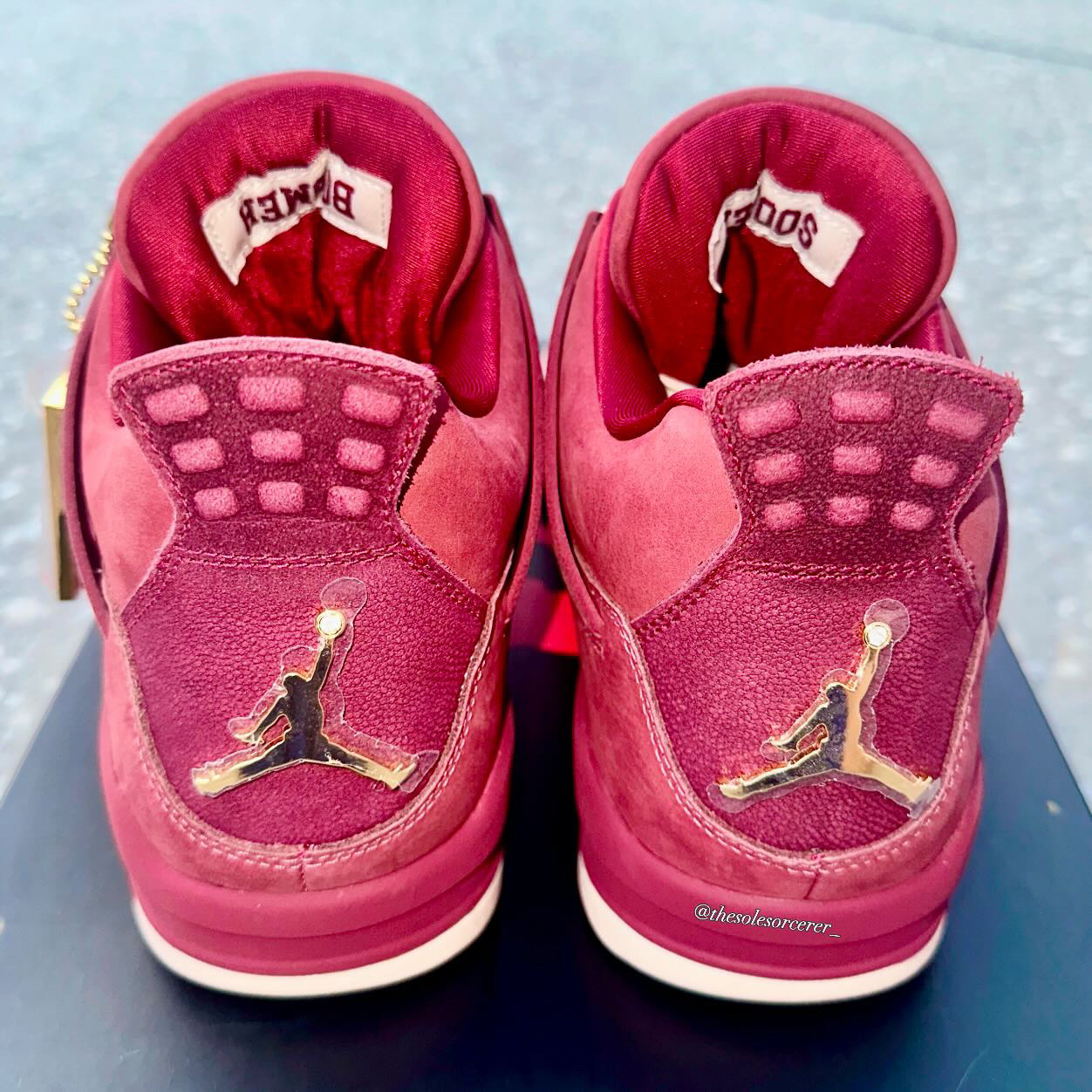 Heel view of the Air Jordan 4 Oklahoma Sooners PE featuring gold Jumpman logos