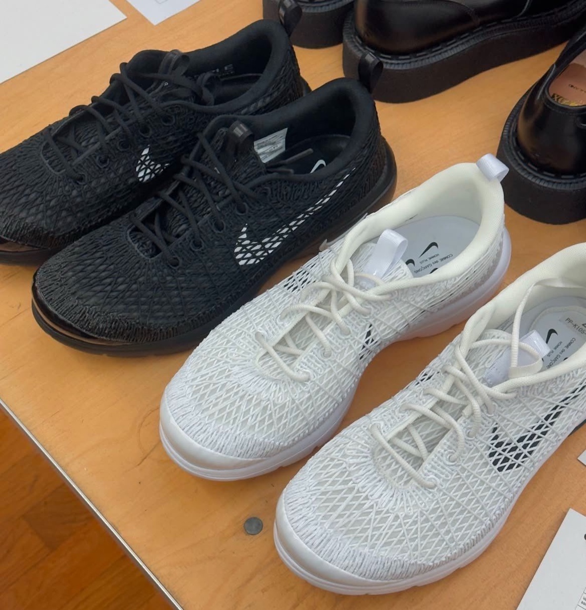 Overhead view of the black and white CDG x Nike Air Rejuven8 with its updated mesh construction.