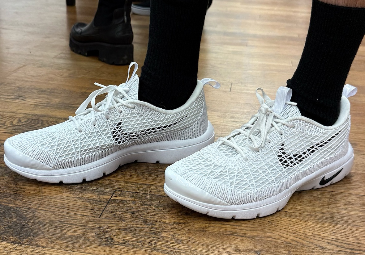 Top-down look at the white CDG x Nike Air Rejuven8 showcasing its fishnet-style upper.