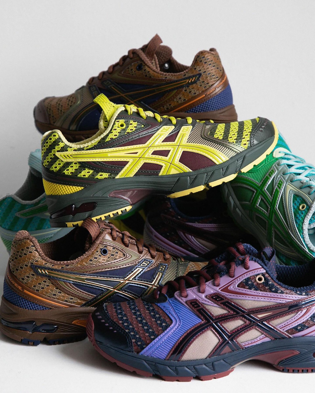 Close-up of Kiko Kostadinov x ASICS GEL-DS Trainer 14 2025 collection showcasing intricate multi-color designs, textured uppers, and bold ASICS stripes.