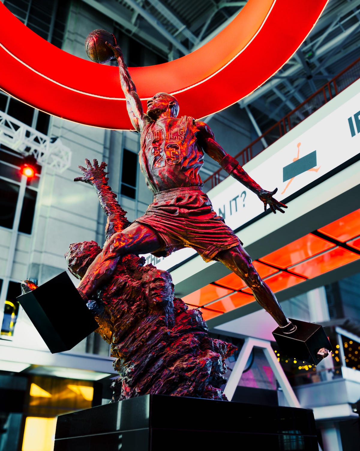 Close-up of Michael Jordan statue's feet with black bars mimicking the 1985 "Banned" campaign.