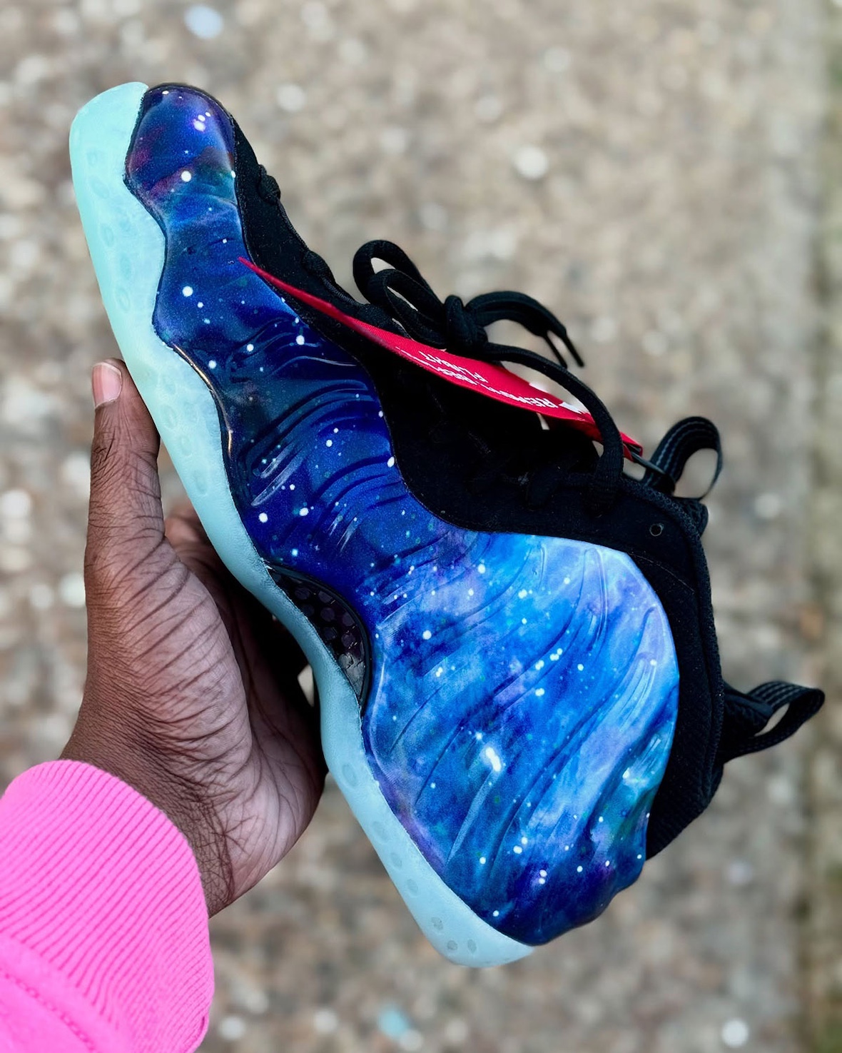 Nike Air Foamposite One Galaxy 2025 lateral side featuring a seamless molded shell, carbon fiber shank plate, and glow-in-the-dark translucent outsole