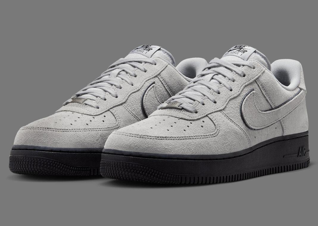 Nike Air Force 1 Smoke Grey Suede angled front view showing dual-layered Swoosh.