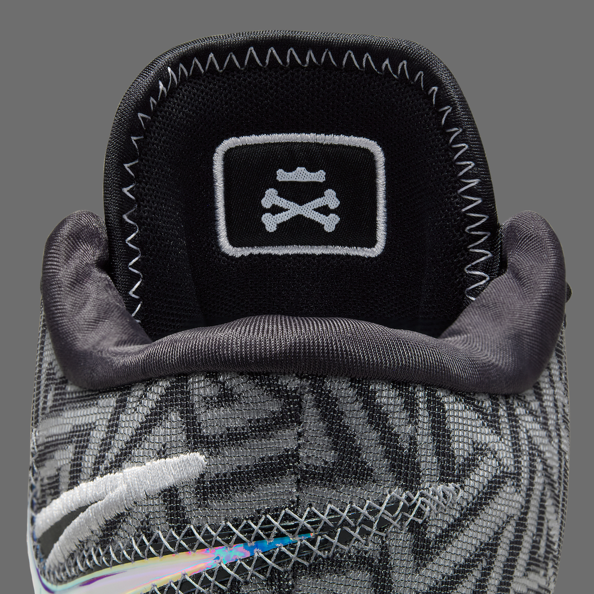 Close-up of Nike LeBron NXXT Genisus Black with Skull-and-Crossbones detail on tongue