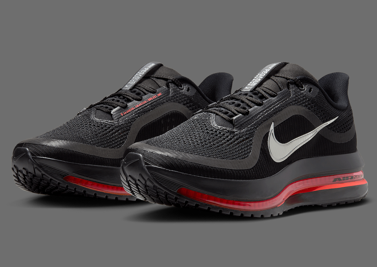Nike Pegasus Premium Black Bright Crimson angled view showcasing black upper, silver Swoosh, and crimson accents