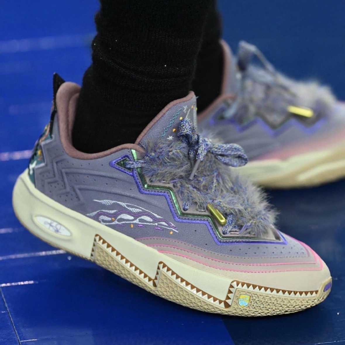 Close-up of the ANTA KAI 2 sneaker featuring furry shoelaces and zig-zag patterns.