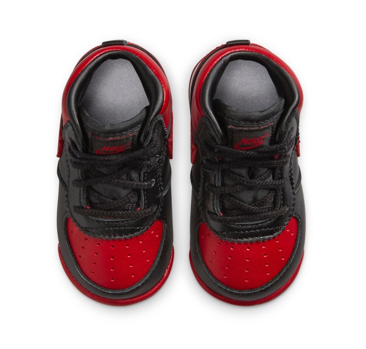 Top view of Air Jordan 1 High 85 Bred Toddler DV3655-067 highlighting perforated red toe box and black laces.