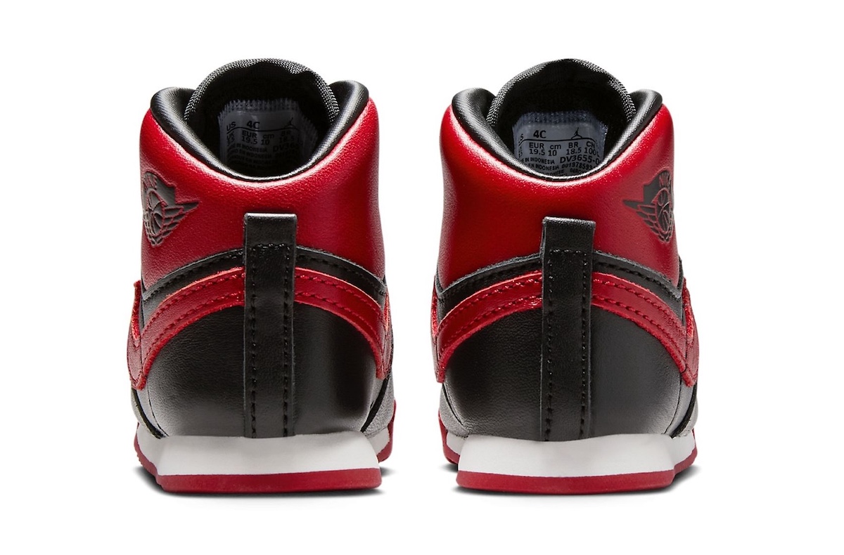 Rear view of Air Jordan 1 High 85 Bred Toddler DV3655-067 with red heel panel and black pull tab.