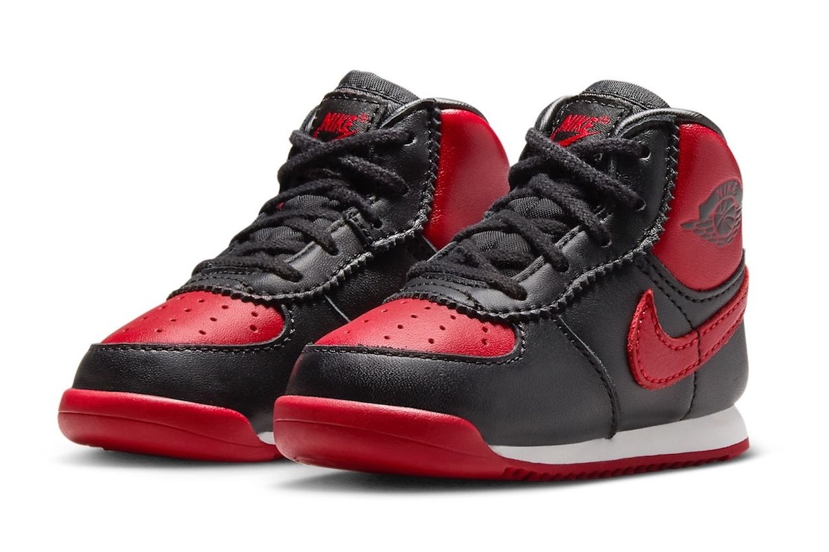 Side view of Air Jordan 1 High 85 Bred Toddler DV3655-067 showcasing bold black and red colorway with Nike branding.