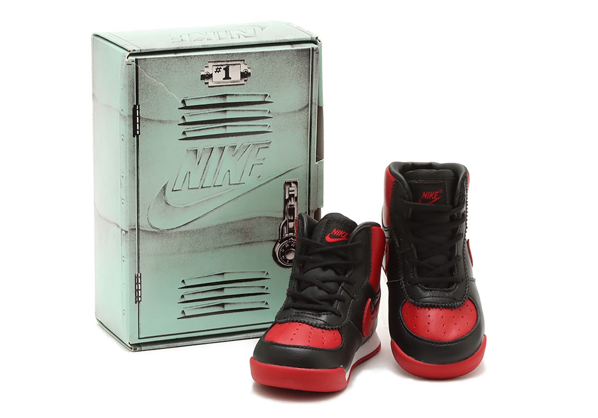 Air Jordan 1 High 85 Bred Toddler Shoes DV3655-067 with special edition Nike locker-themed packaging, black and red leather design.