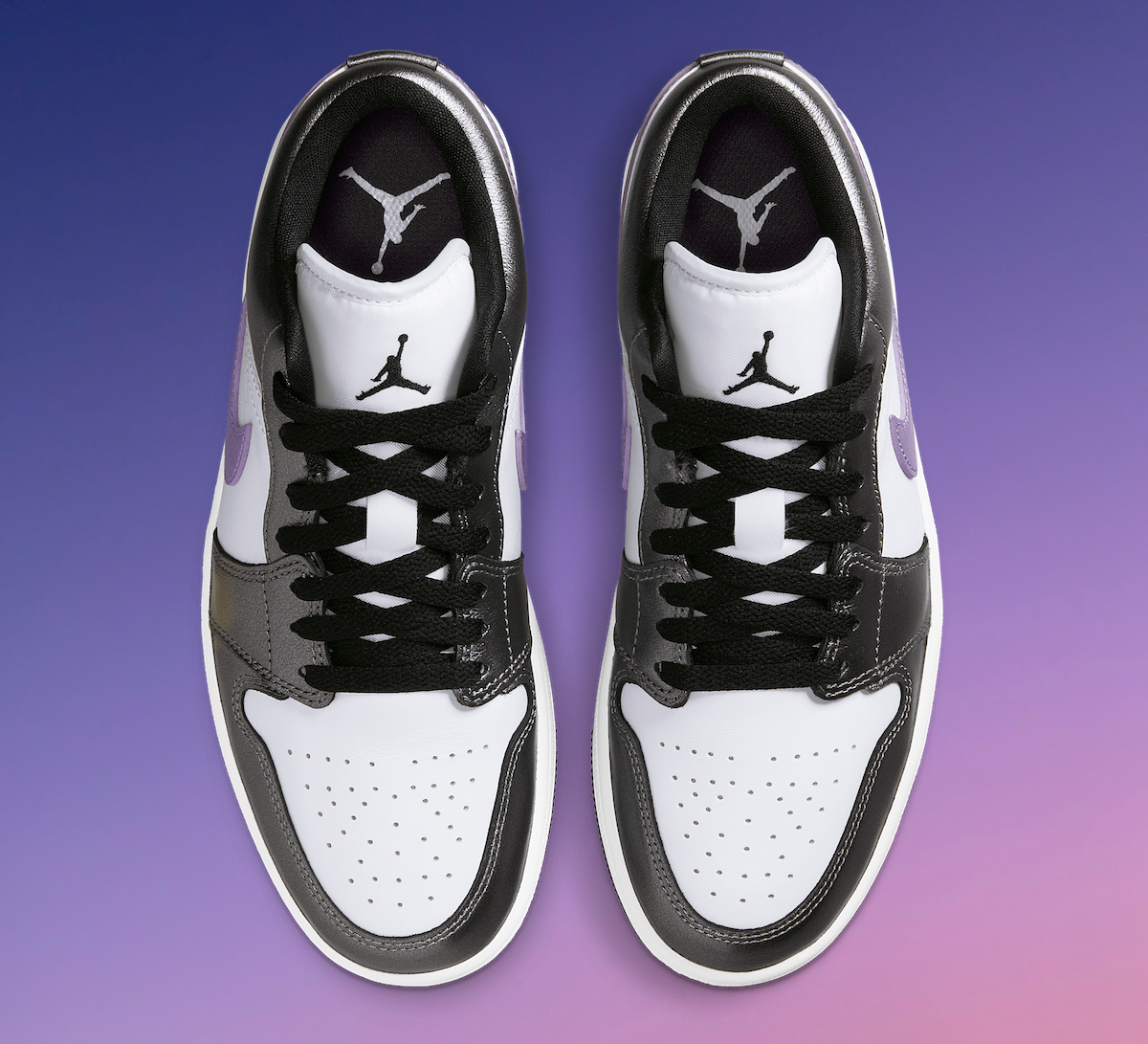 Top view of Air Jordan 1 Low Purple HJ5910-105 highlighting perforated white toe box, black laces, and Jumpman logo on the tongue.