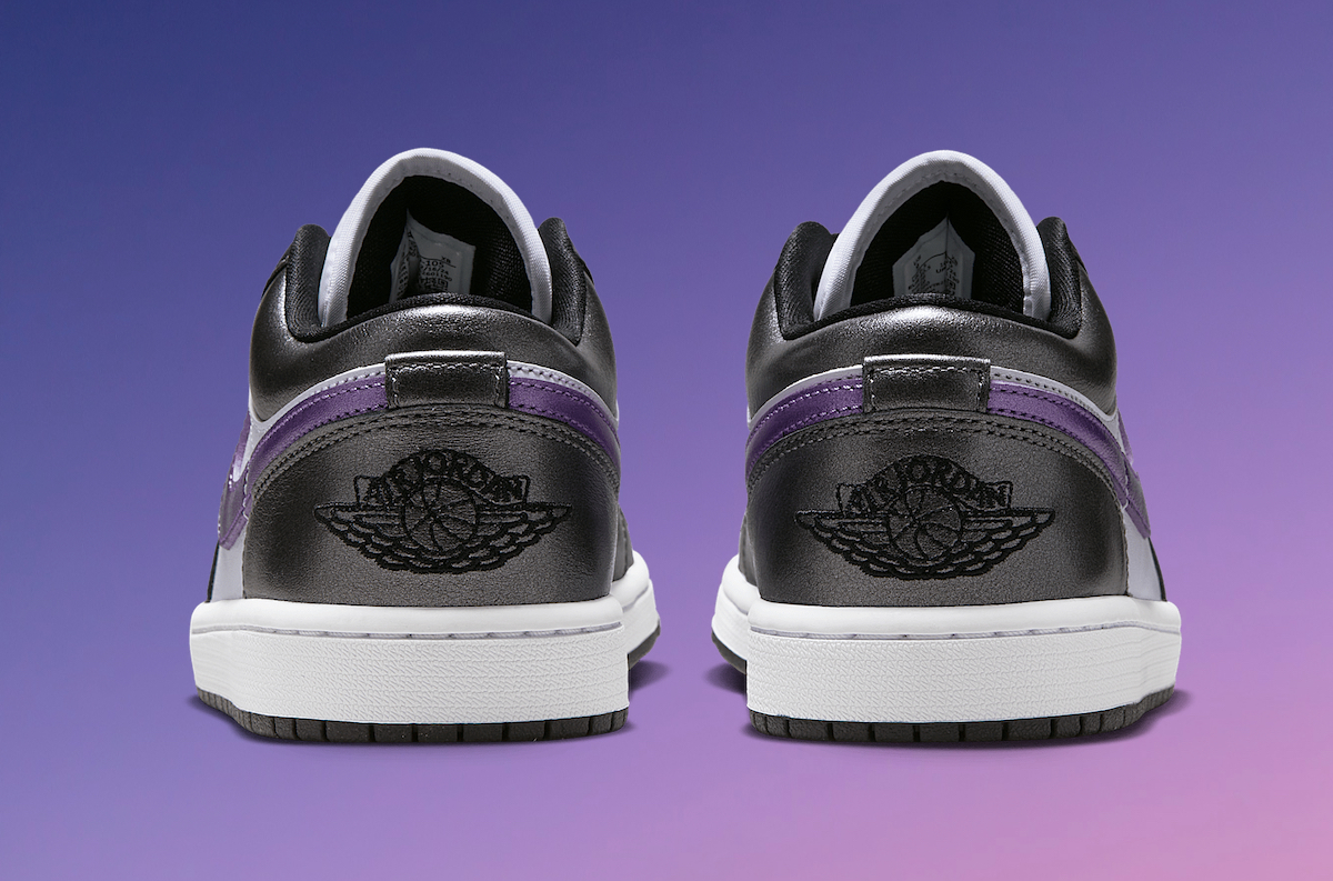 Rear view of Air Jordan 1 Low Purple HJ5910-105 featuring black Wings logo embroidery, purple suede Swoosh wrapping the heel, and metallic black overlays.