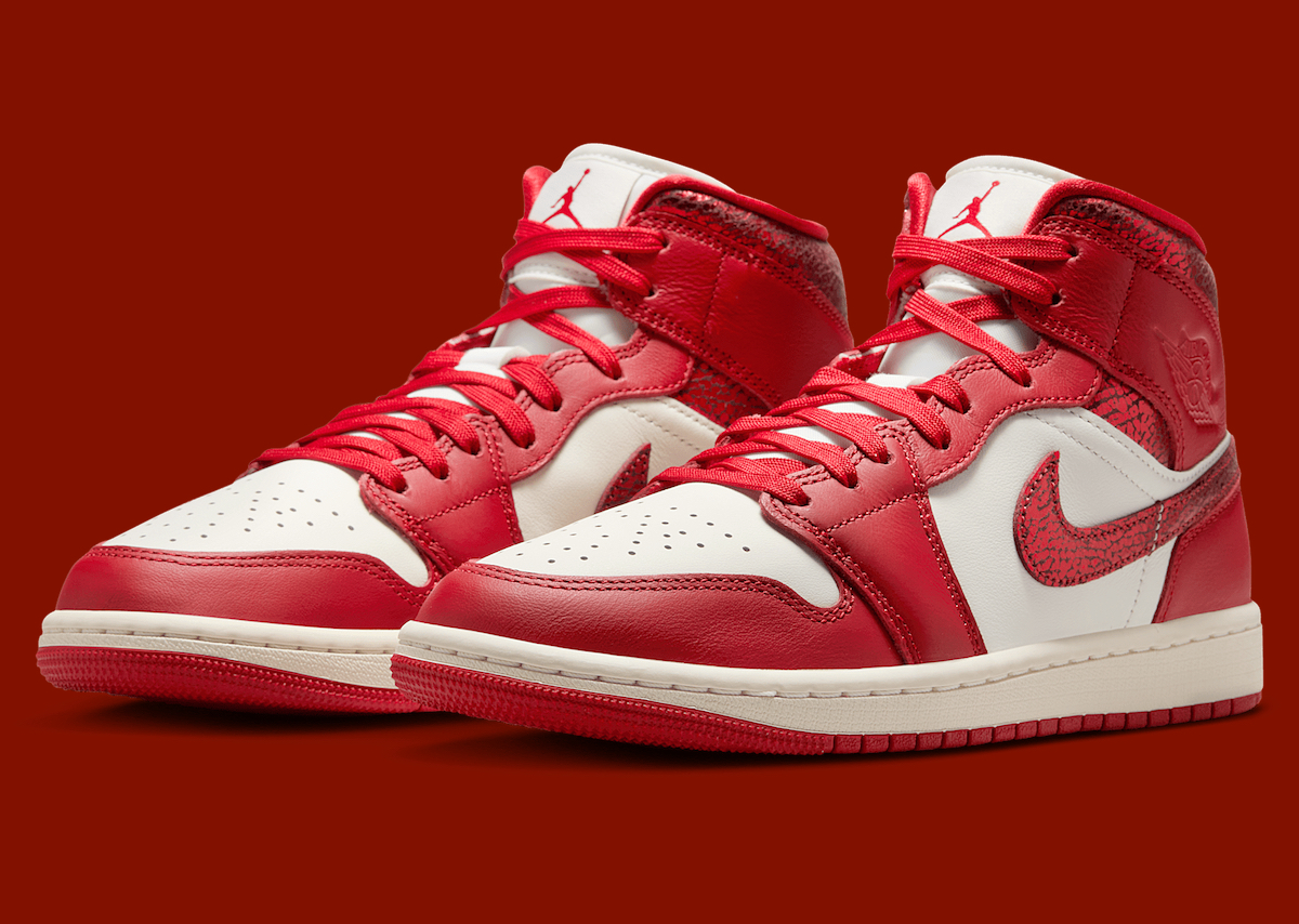 Air Jordan 1 Mid Valentine’s Day 2025 in Fire Red and white leather with cracked details.