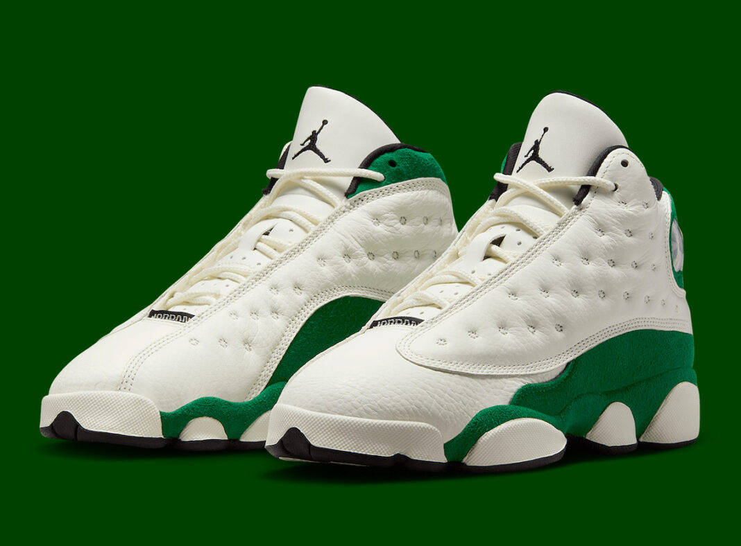 Air Jordan 13 GS Pine Green sneakers featuring white leather uppers with green suede overlays and black accents.