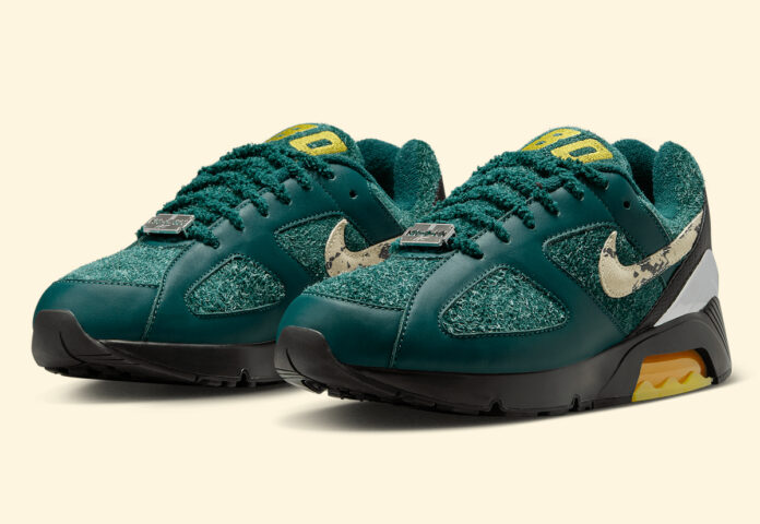 Apron Records x Nike Air 180 'Dark Atomic Teal' FZ3309-300 sneaker featuring a mix of teal leather, fuzzy suede, a speckled Swoosh, and a visible Air unit.