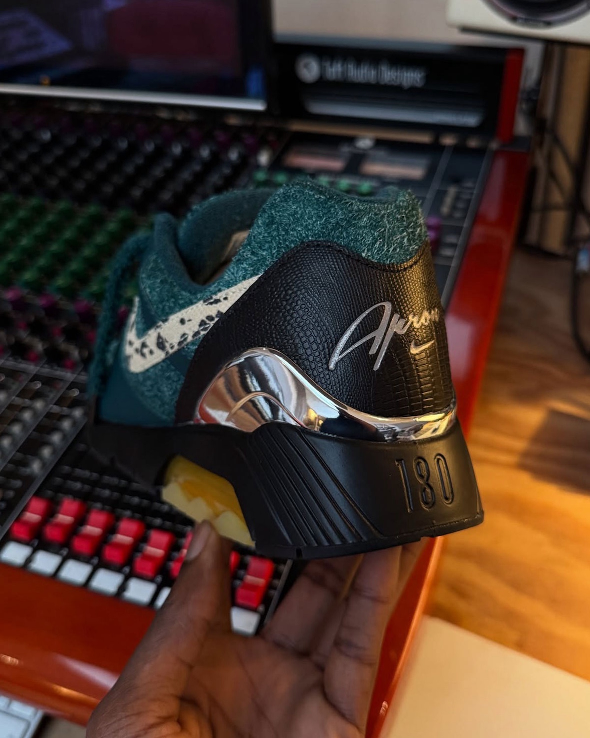 Rear view of the Apron Records x Nike Air 180, highlighting faux croc heel and Apron logo.