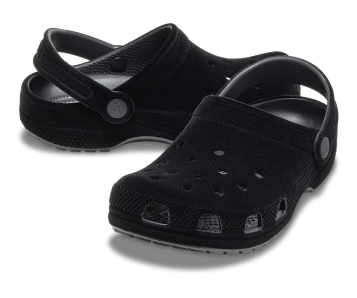 Angled view of the Black Crocs Classic Clogs, displaying the soft-touch upper and heel strap.