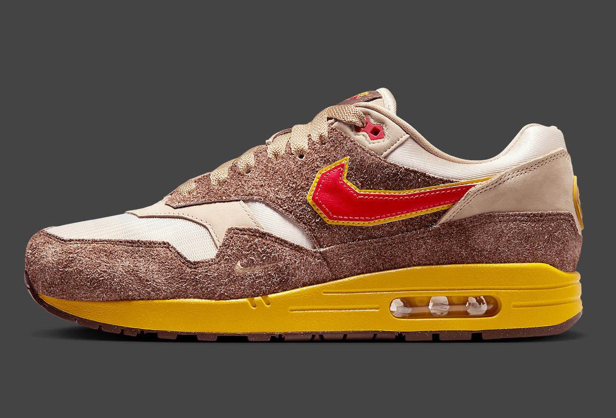 Side profile of the .SWOOSH x Nike Air Max 1 Big Head Origins featuring jagged Swoosh details.