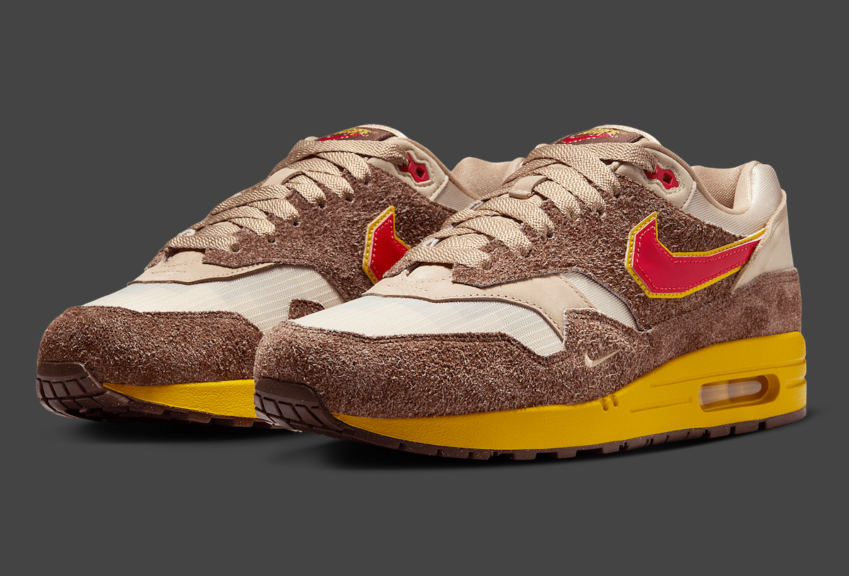 Front view of the .SWOOSH x Nike Air Max 1 Big Head Origins showcasing brown suede and red Swoosh.