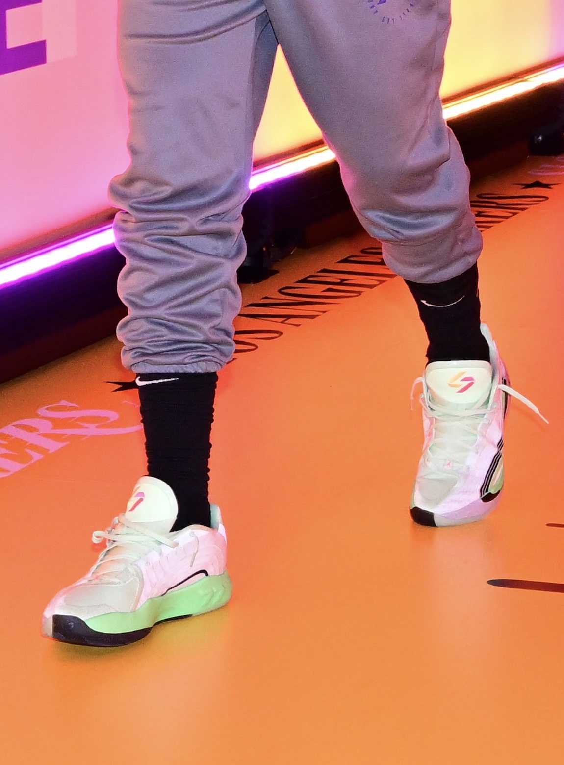 Close-up of Jordan Luka 4 in electric green with double-7 logo on the tongue.