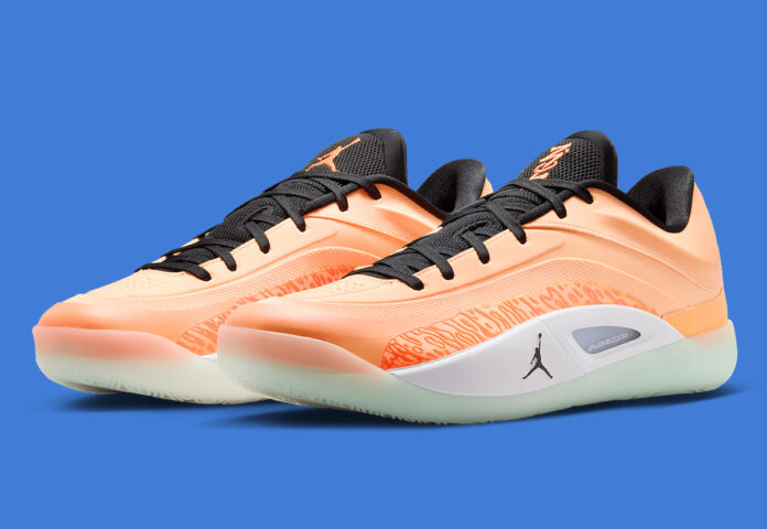 Jordan Zion 4 Forged in Fire - angled front view showcasing Peach Cream and Total Orange upper.