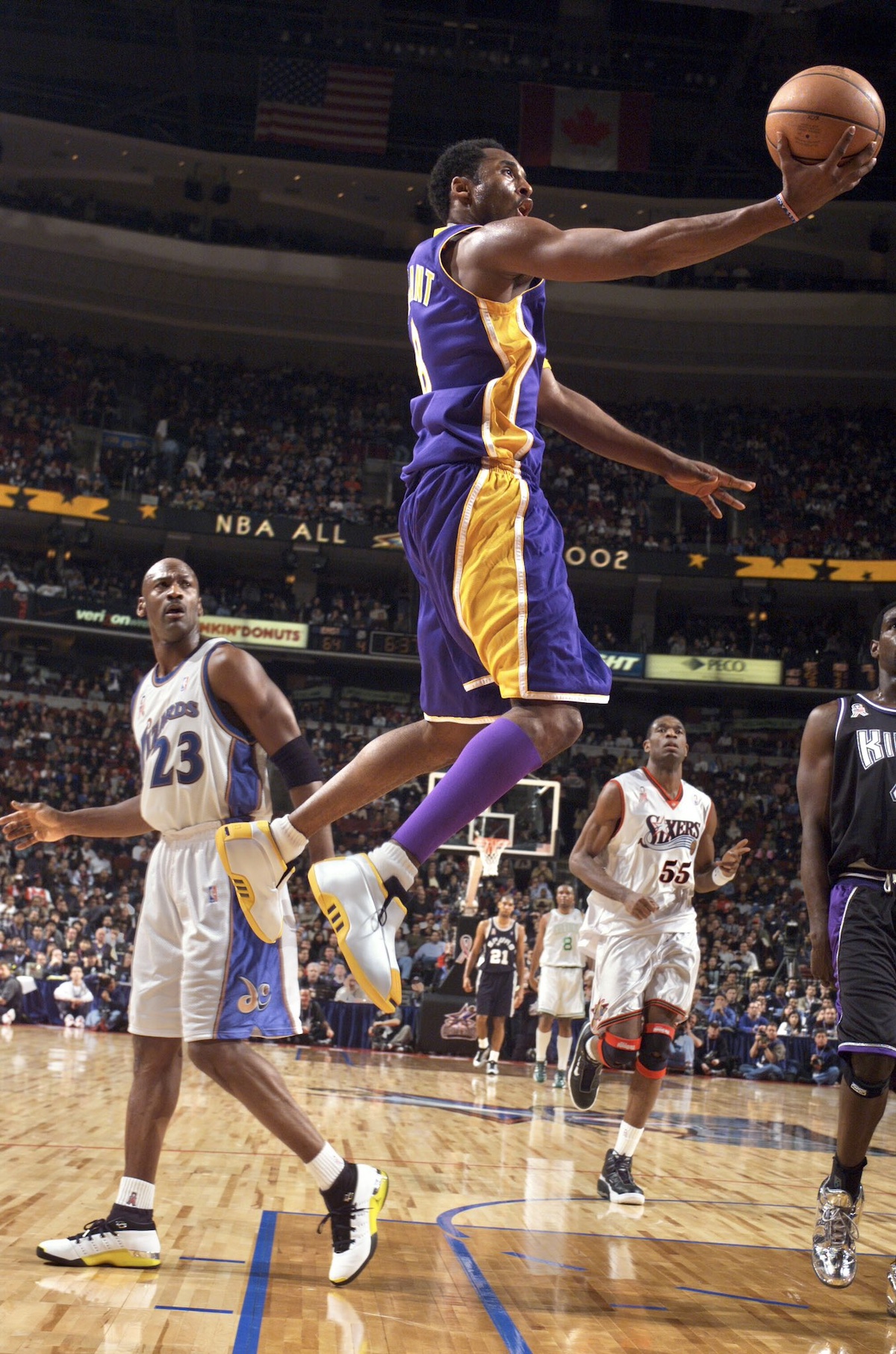 Kobe Bryant wearing the adidas Crazy 2 All-Star in the 2002 NBA All-Star Game, soaring for a layup in his Los Angeles Lakers jersey.