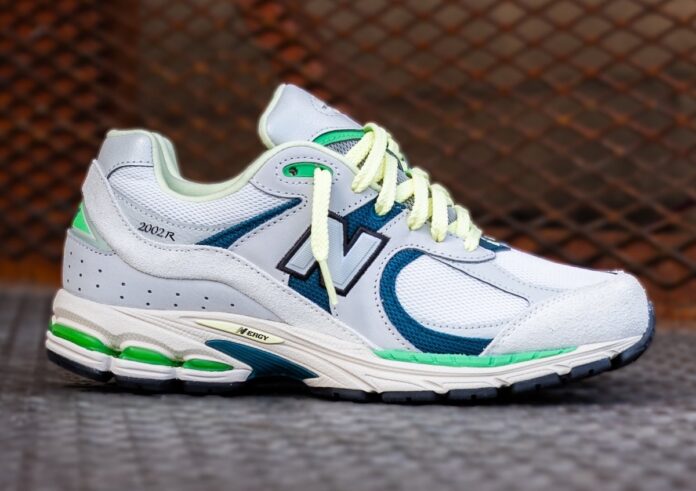 Side view of the New Balance 2002R Green Apple Limelight with grey, green, and blue accents.